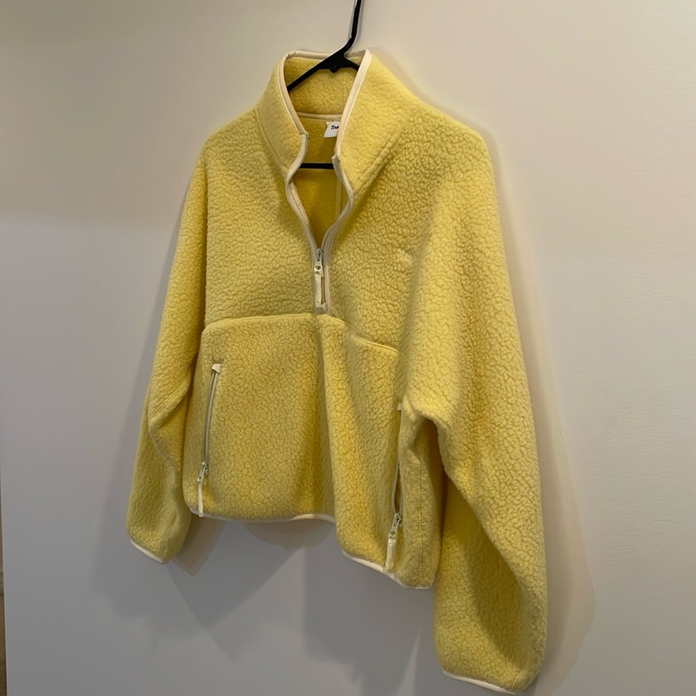 Yellow TNA half zip fleece.